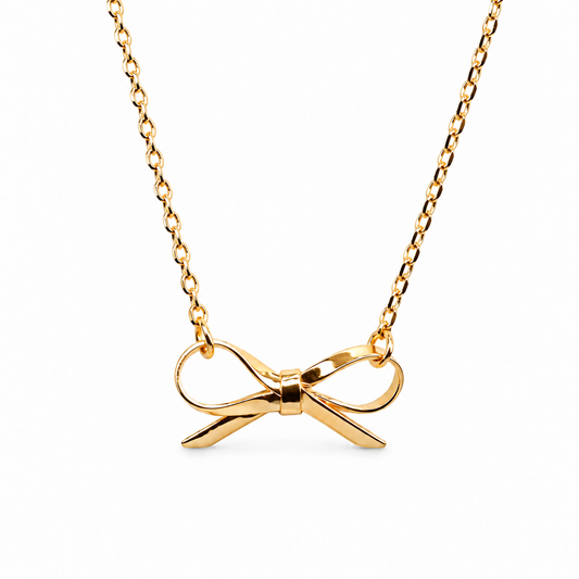 Small Sleek Gloss Festoon Bow Necklace — luxury white background product photo
