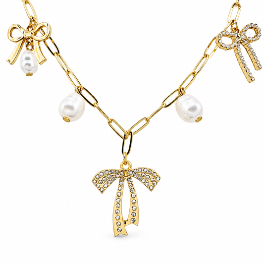 Bows & Pearls Charm Station Necklace — luxury white background product photo
